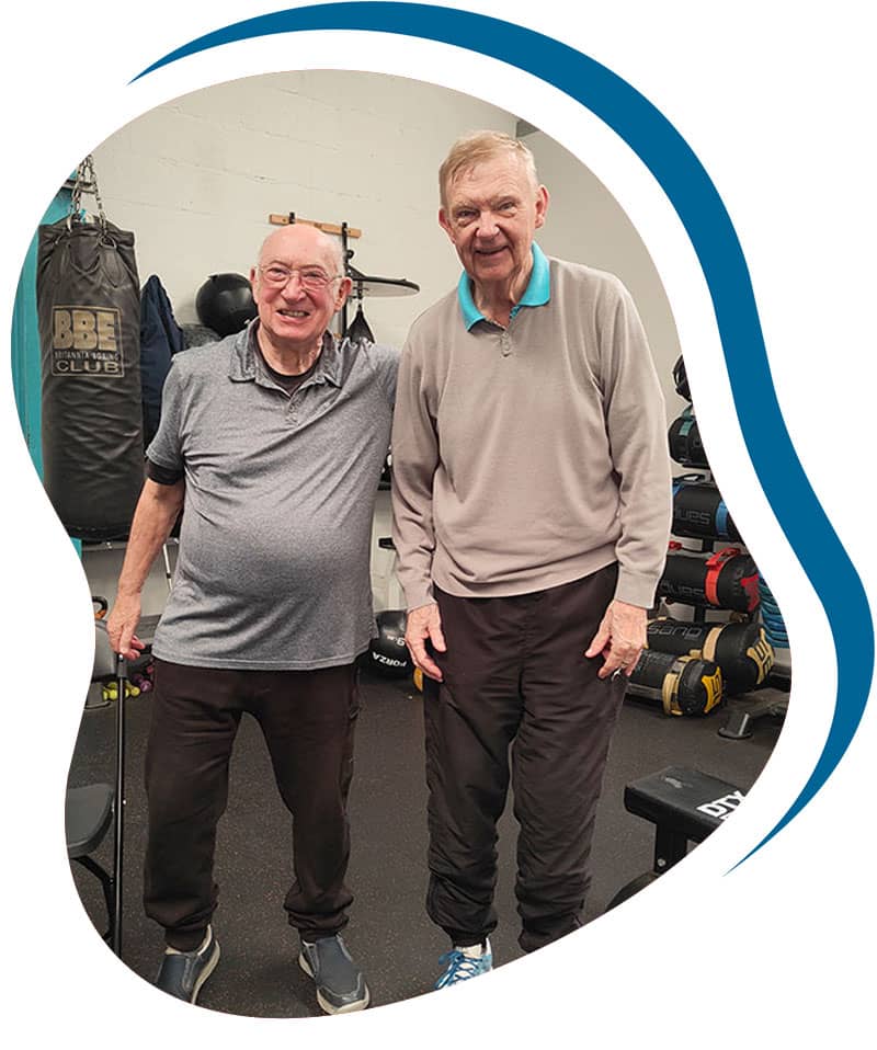 Two men at exercise class in Mold